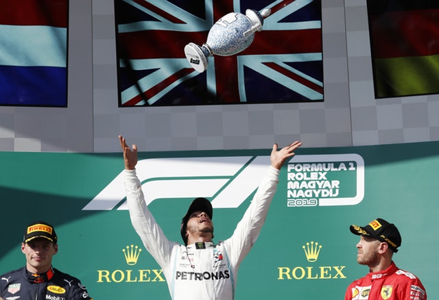 Lewis Hamilton celebrates on the podium